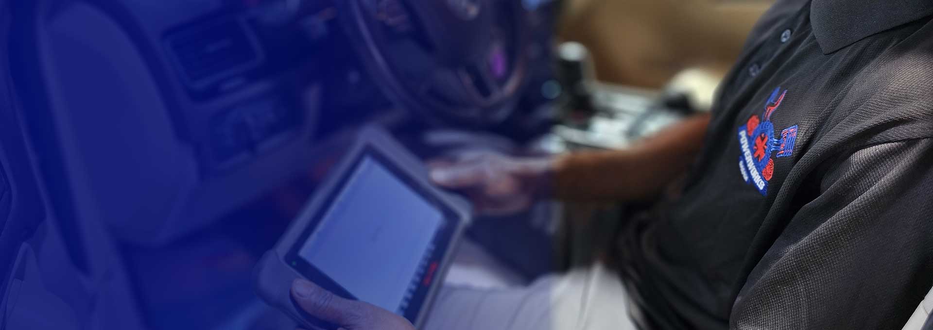 Powerworks Garage technician performing diagnostics